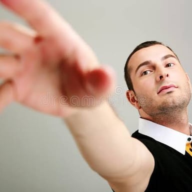 A person reaching toward an object they want.