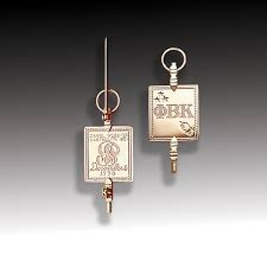 The Phi Beta Kappa key bearing the society’s Greek letters.