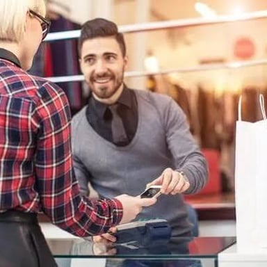 A salesperson presenting a customer with an upgraded product option.