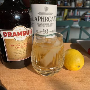 A Rusty Nail cocktail served over ice, made with Scotch whisky and Drambuie.