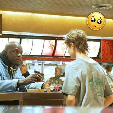 A hungry person asking for food at a dinner table