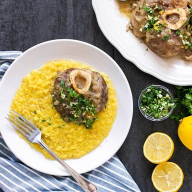 Ossobuco, a Milanese dish of braised veal shanks, served with risotto.