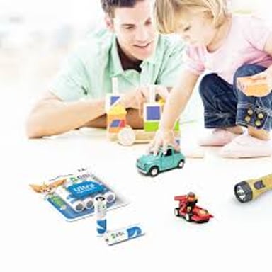 AA batteries shown beside a small battery-powered toy.