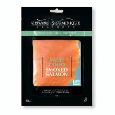 Slices of lox, or smoked salmon, in a smokehouse setting