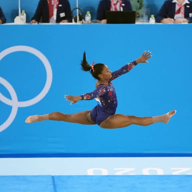 Simone Biles performing an Olympic gymnastics routine