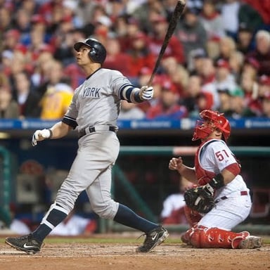 Alex Rodriguez in a baseball uniform at the plate.