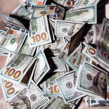 A stack of paper money representing cash.