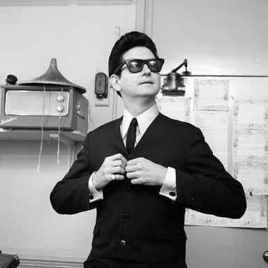 Portrait of singer Roy Orbison, widely recognized for his dark glasses and distinctive voice.