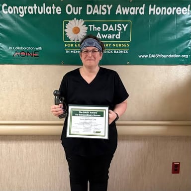 A person receiving recognition at an award ceremony.