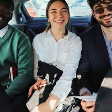 Several people traveling together in one car.