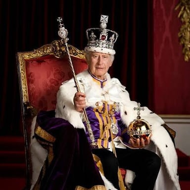 A monarch on a throne, representing the act of ruling.