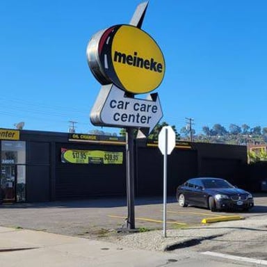 Exterior sign for a Meineke Car Care Center, an automotive repair business.