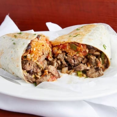 A burrito filled with grilled carne asada beef.