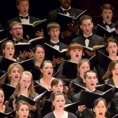 A choir singing the same melody together.