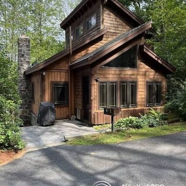 A row of simple cabins that could serve as budget vacation rentals.