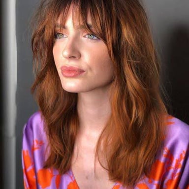 Hair with visible volume and fullness.