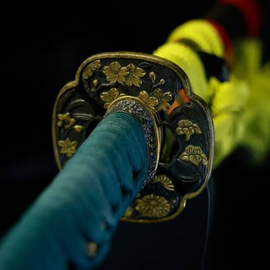 A traditional Japanese katana with a gently curved blade and long wrapped handle.