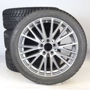 A vehicle wheel fitted with a Bridgestone tire.