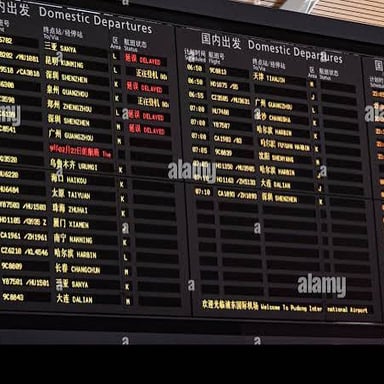 An airport departures board listing flight times