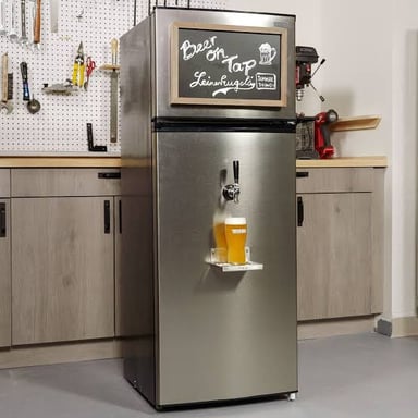 A home kegerator with a chilled keg connected to a tap.