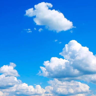 White clouds against a blue sky.