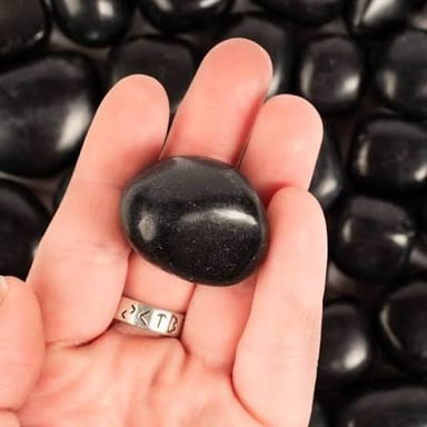 A polished black onyx gemstone.