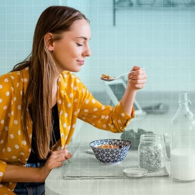 A person taking a bite of food during a leisurely meal.