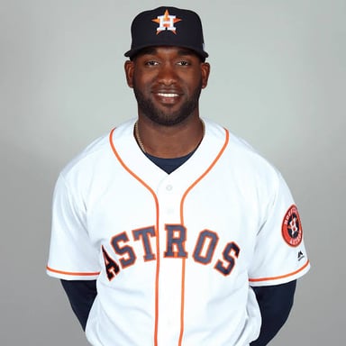 A Houston Astros player on a baseball field.