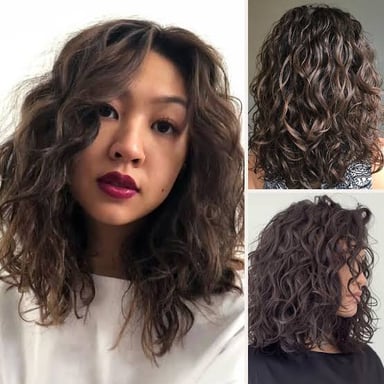A person with a curly hairstyle created by a perm.