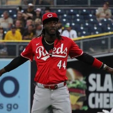 Baseball player Elly De La Cruz in a Cincinnati Reds uniform.