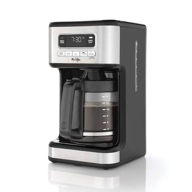 A Mr. Coffee drip machine brewing coffee into a carafe.