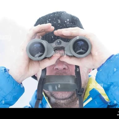 A person looking at and noticing an object.