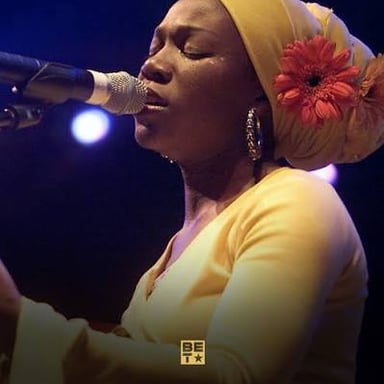 Singer India.Arie performing on stage.