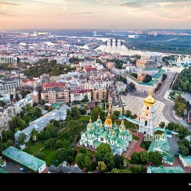 A view of Kyiv, Ukraine, with historic architecture near the Dnieper River.