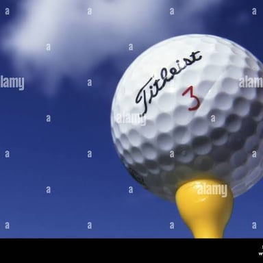 A golf ball resting on a tee.