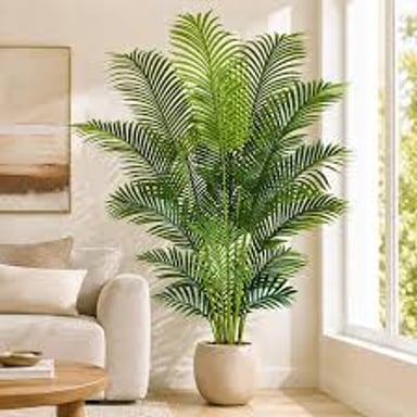 An artificial leafy tree in a pot, used as decoration instead of a living plant.