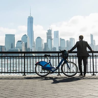 A person riding a bicycle on a city street.