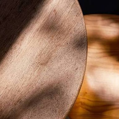 The outer edge of a tabletop, where its surface ends.