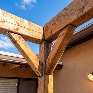 A diagonal brace reinforcing a wooden frame.