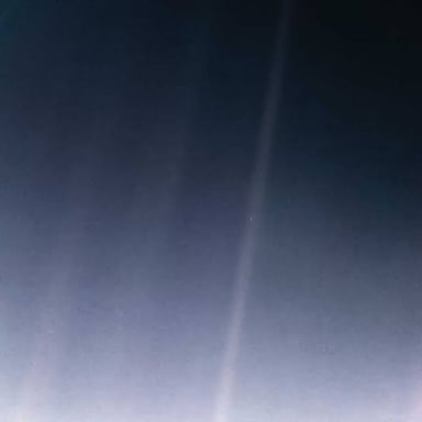 The famous photograph showing Earth as a tiny pale blue dot in space.