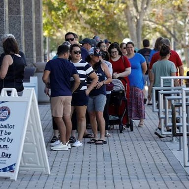 Voters casting ballots to choose someone for office.