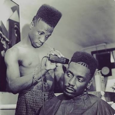 A hairstyle with a tall top and closely faded sides.