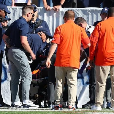 A sports team struggling during a game, illustrating the figurative sense of “stink.”
