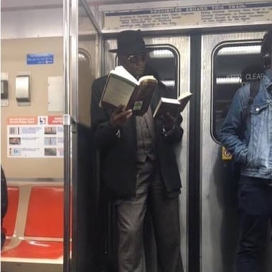 A person reading an open book.