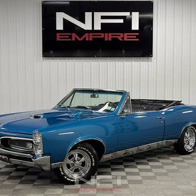 A classic Pontiac GTO, a high-performance American car.