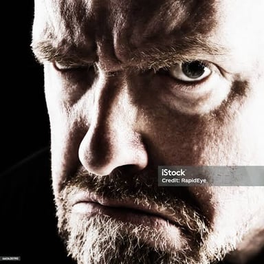 A person looking at someone with an angry, disapproving expression.
