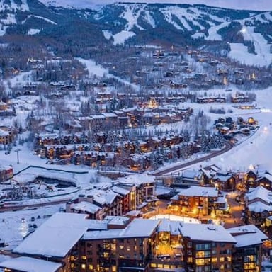 The Colorado mountain town of Aspen beneath the surrounding Rocky Mountains.