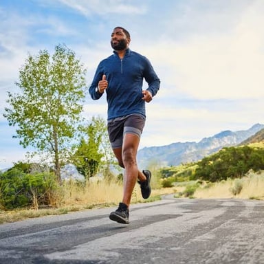 A person jogging energetically, illustrating pep and vigor.