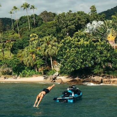 A Sea-Doo personal watercraft being ridden across open water.
