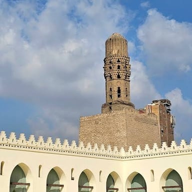 A mosque minaret rising beside the main prayer hall.